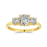 18K gold ring with three round white moissanite stones and AU750 stamp