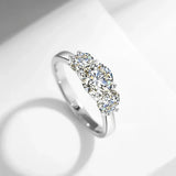 Elegant 18K gold ring with three natural white moissanite stones in round cut