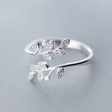 Silver open band ring with delicate leaf-shaped zircon accents, elegant floral design