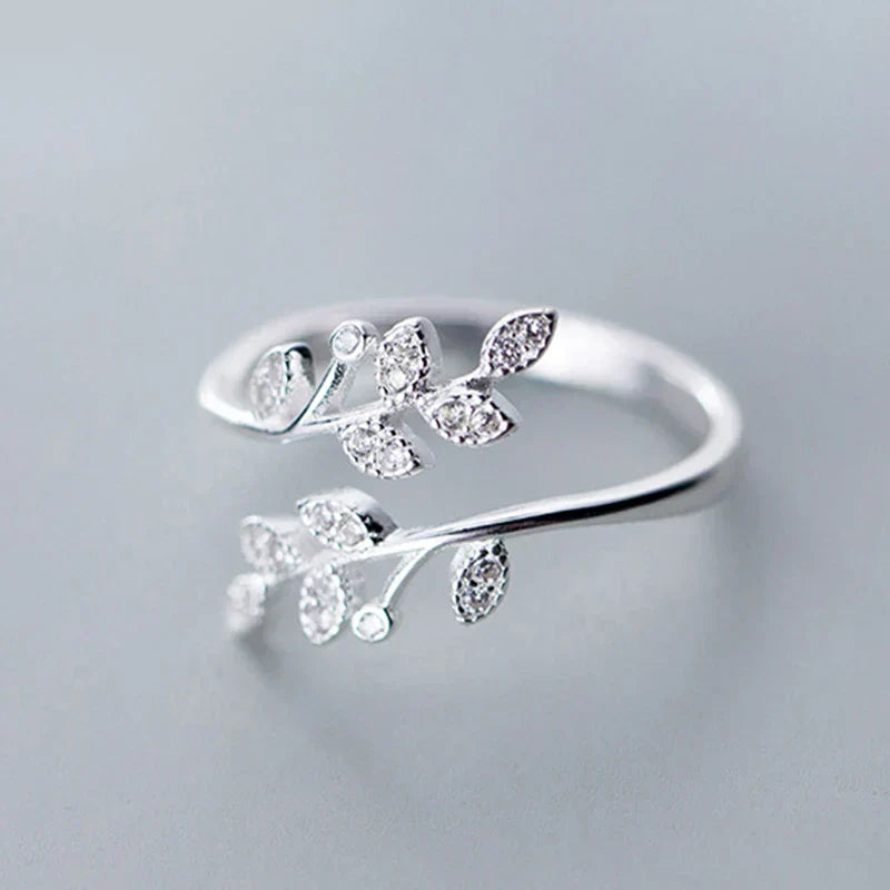 Silver open band ring with delicate leaf-shaped zircon accents, elegant floral design
