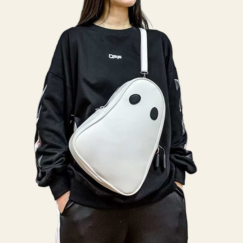 Halloween cartoon ghost shaped white crossbody bag worn with black outfit