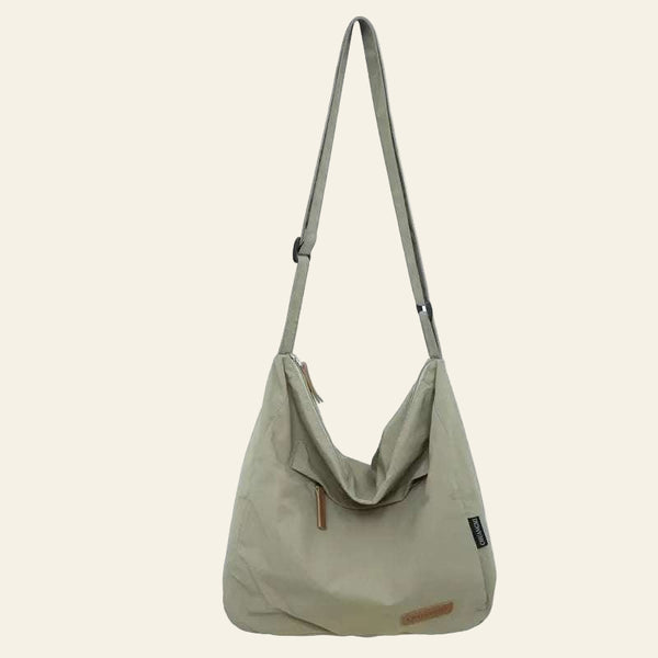 Minimalist Japanese Women Men Shoulder bag in beige with adjustable strap and zipper closure