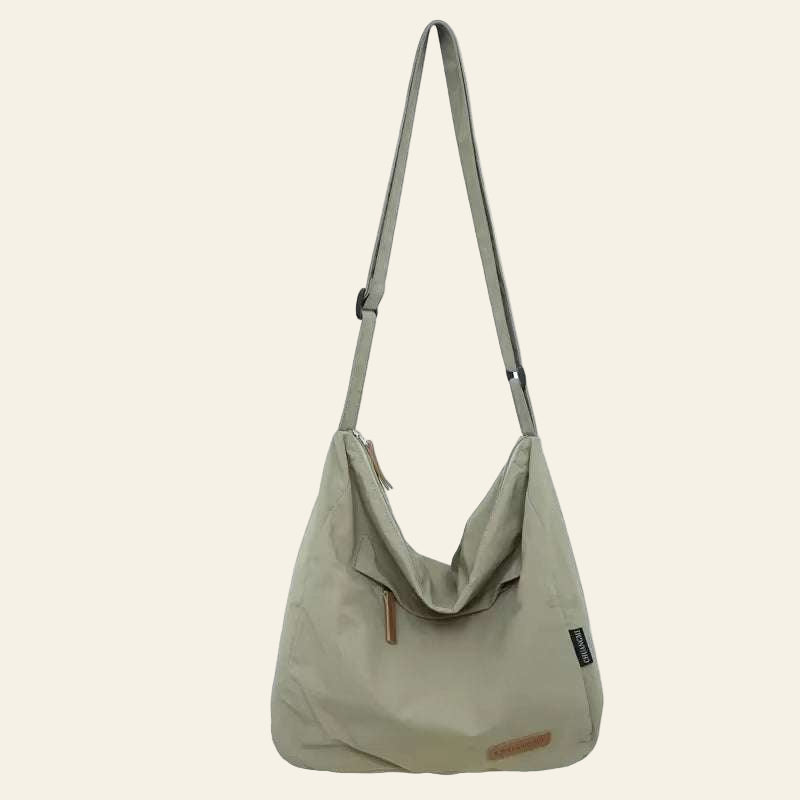 Minimalist Japanese Women Men Shoulder bag in beige with adjustable strap and zipper closure