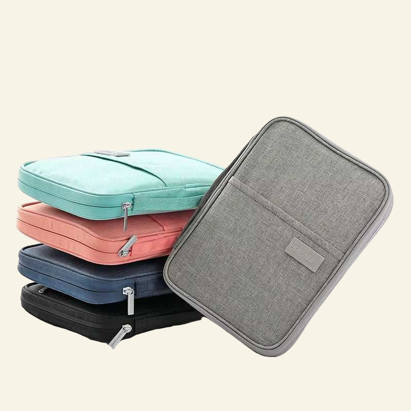 Waterproof passport holders in blue, pink, navy, black, and grey colors stacked with zipper closures