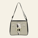 Cow print small shoulder bag with cartoon cow face design and adjustable strap